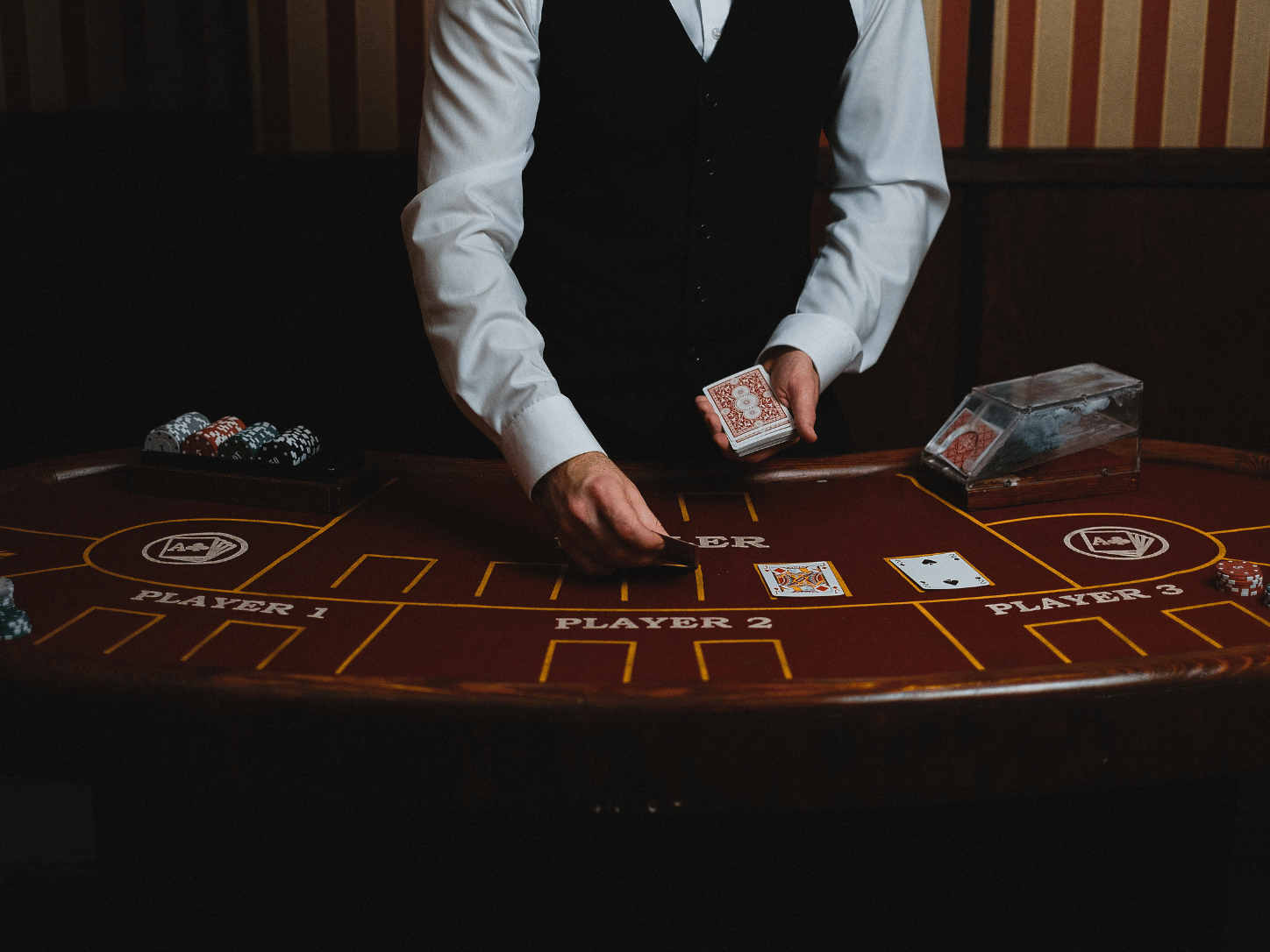 Professional casino dealer at blackjack table Las Vegas lesson