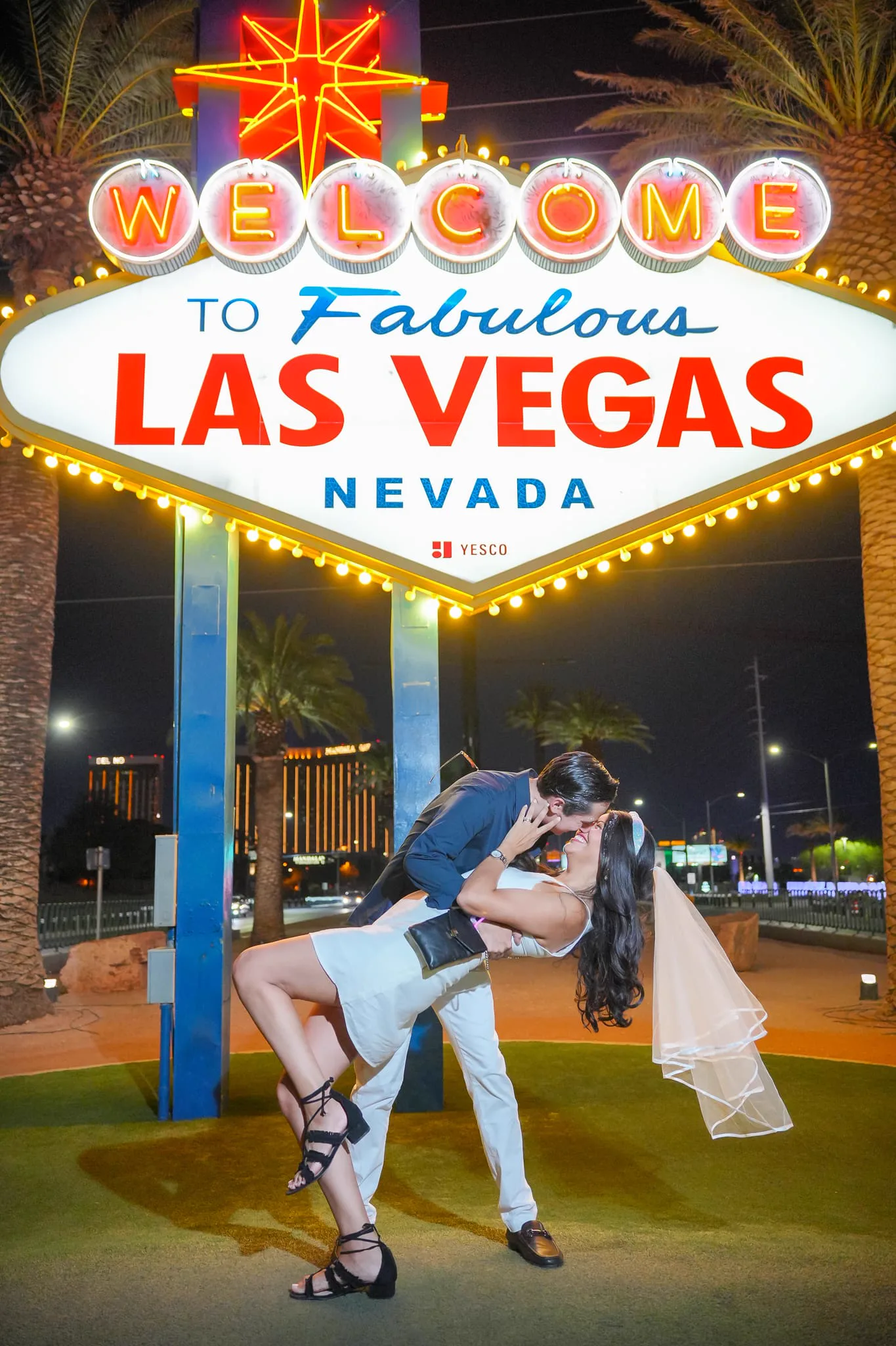 Couple at Las Vegas Sign on GXP Tours party bus