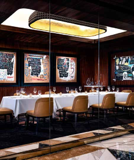 Private dining room with a long table and graffiti-style artwork
